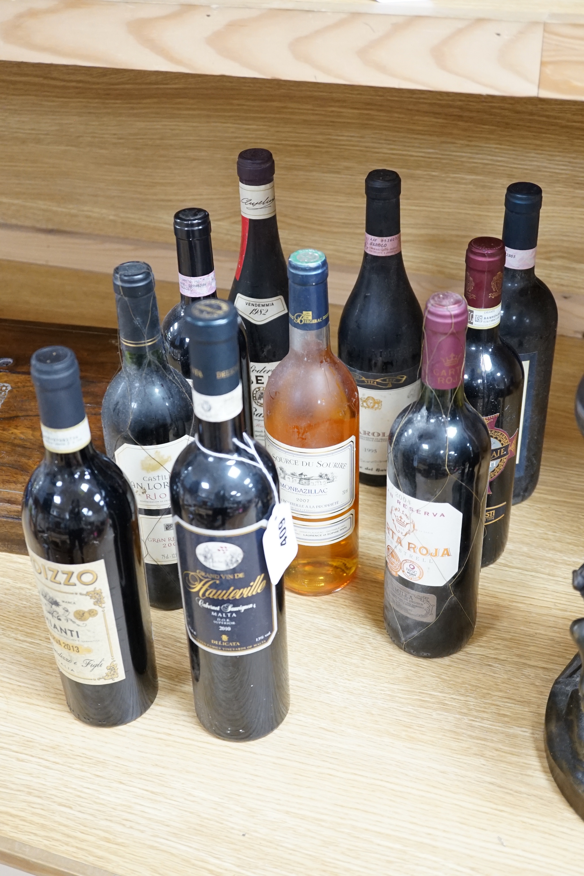 Ten bottles of wine, some Spanish including Barolo and Chianti